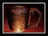 C013.  Wheel thrown mug, with rusted barbed wire handle.