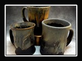 C038.  Wheel thrown mugs, glaze series E.